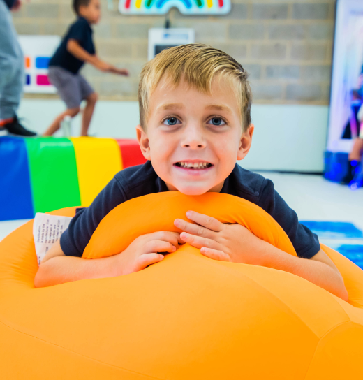 Boy smiling in a sensory room