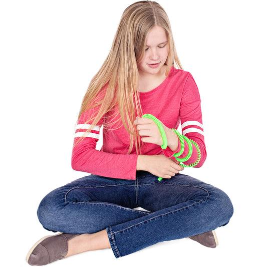 Girl using the green Chewy Fidget Coil