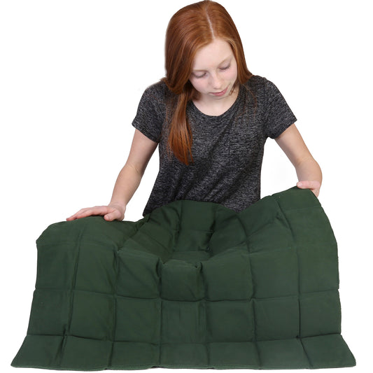 Girl holding the green Jumbo Weighted Lap Pad