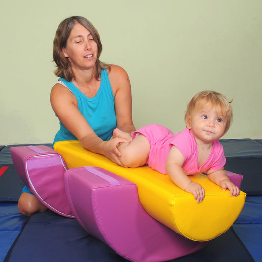 Mother helping baby play on The GYMBOX