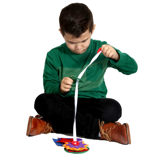 Boy playing with the Button Pizzazz