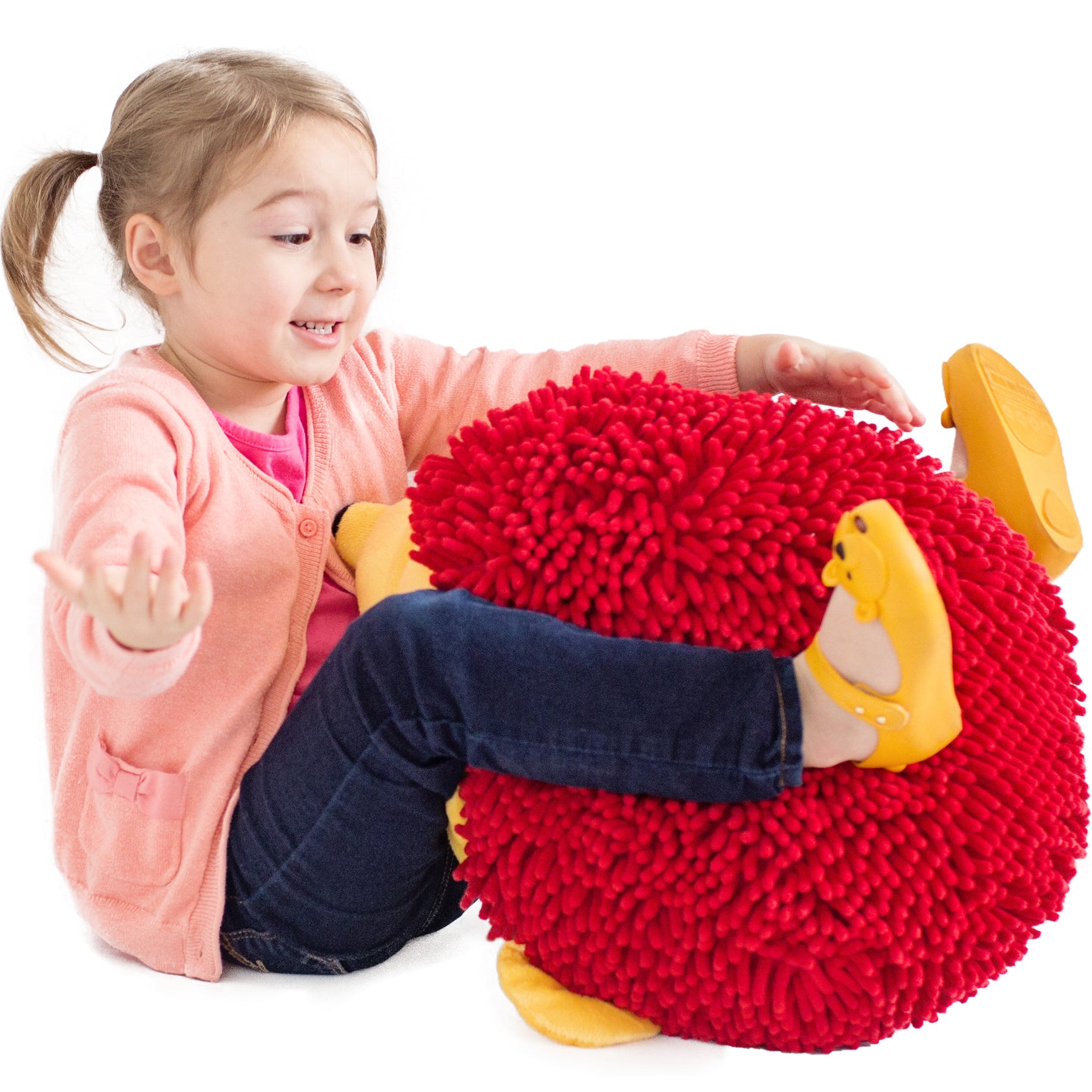 Girl smiling while playing with Harry the Sensory Hedgehog