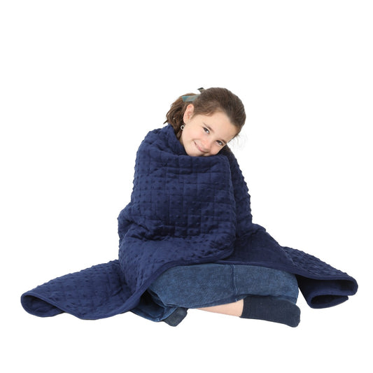 Girl smiling while using the Minky Weighted Blanket