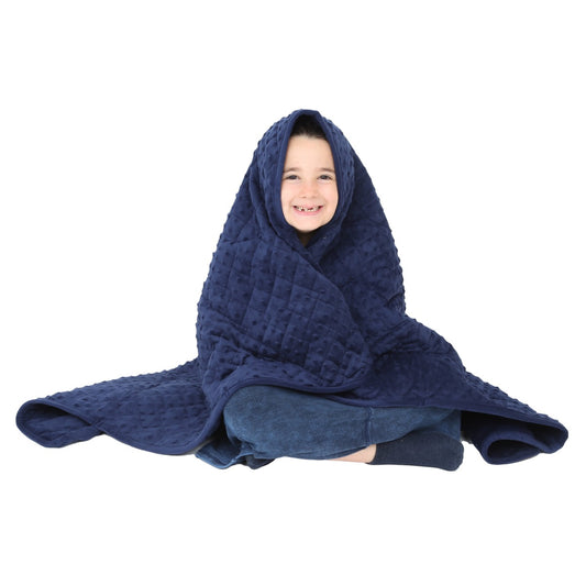 Girl smiling while using the Minky Weighted Blanket
