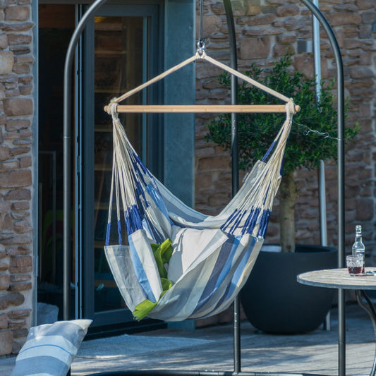hammock chair hanging on swing stand outdoors