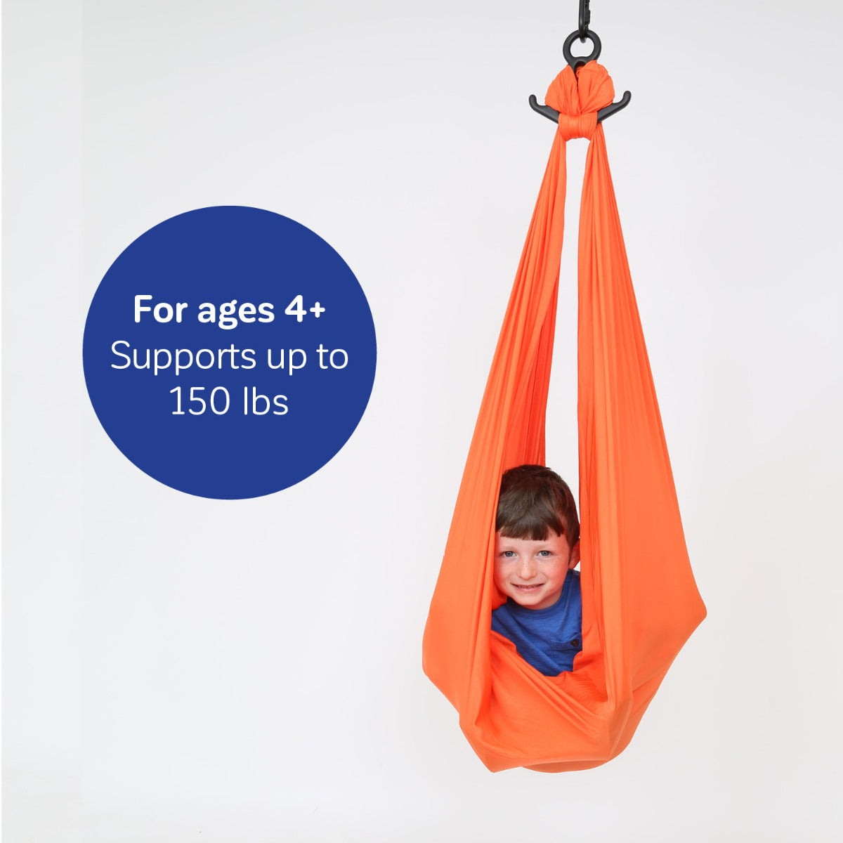 boy sitting inside orange orange Cozy Compression Swing