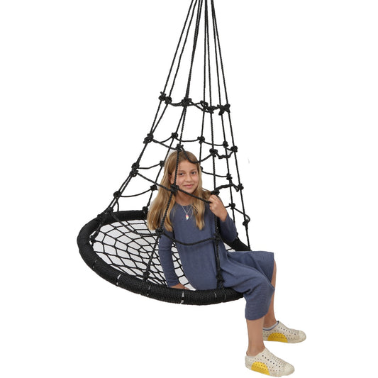 Girl smiling while sitting on the Web Tower Swing
