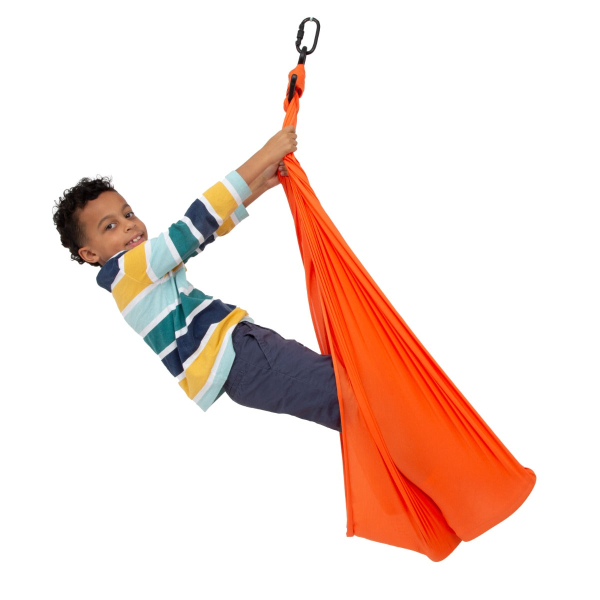 boy standing while swinging on the orange Cozy Compression Swing