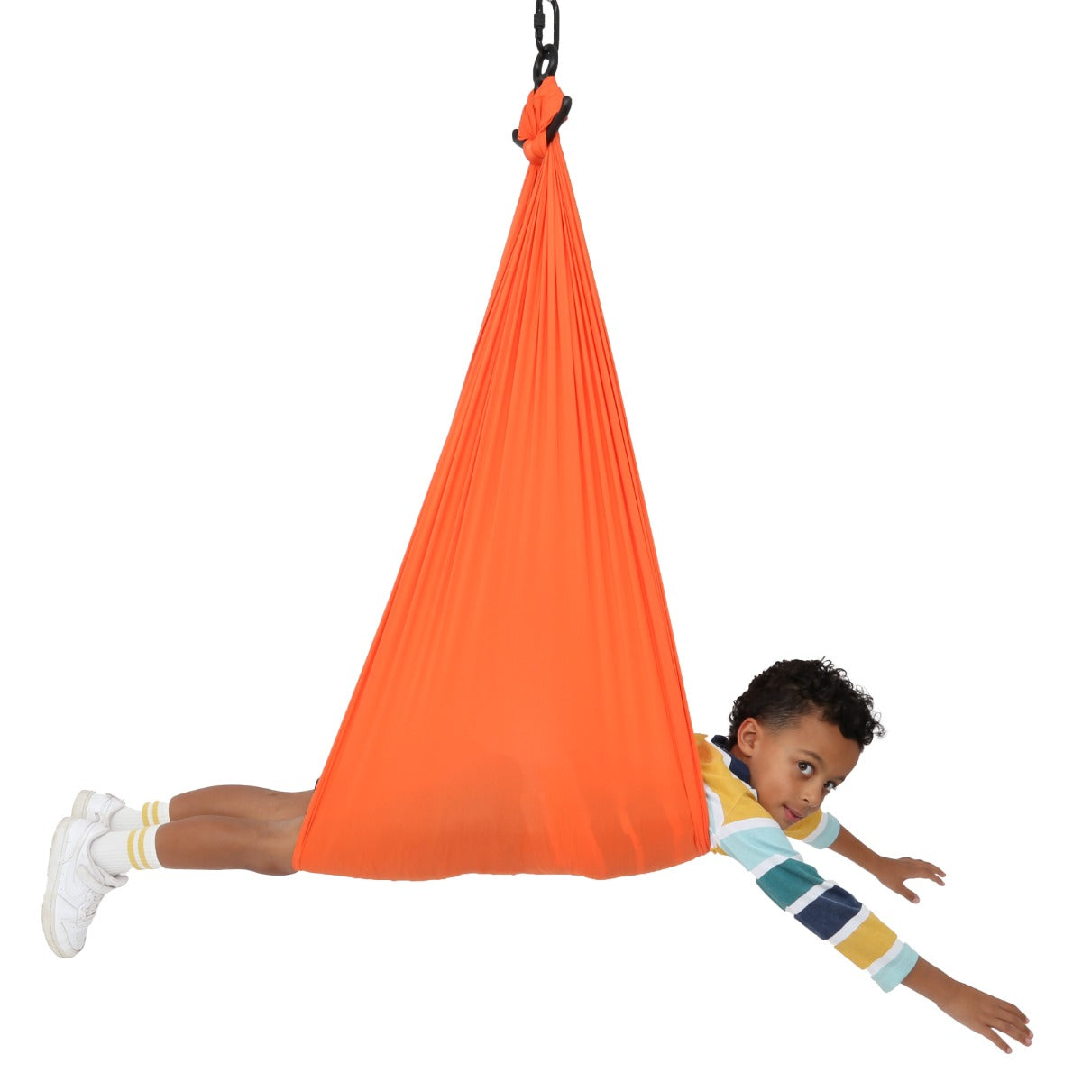 boy laying in orange Cozy Compression Swing