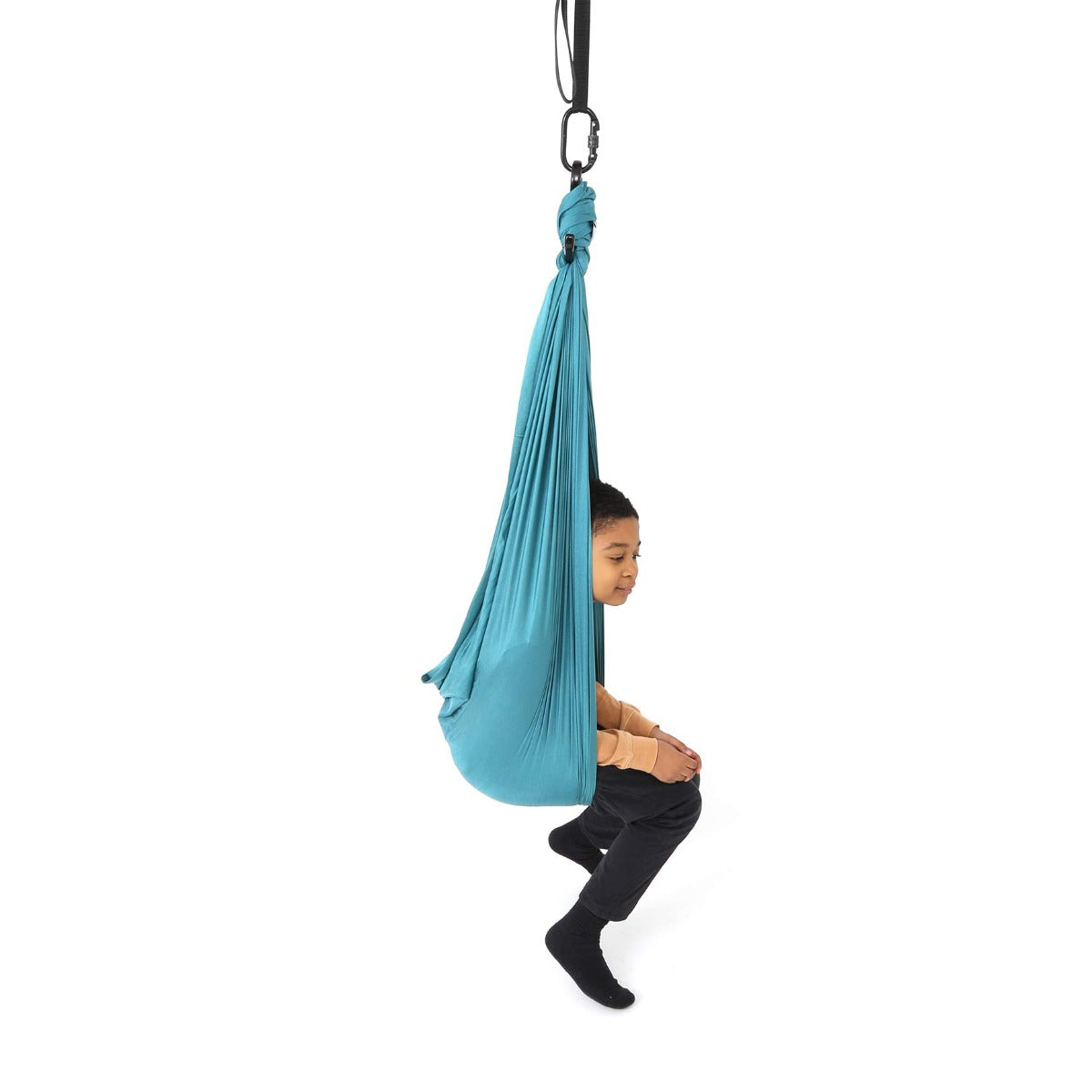 girl sitting in the teal Cozy Compression Swing