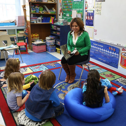 Teacher reading to children in a classroom