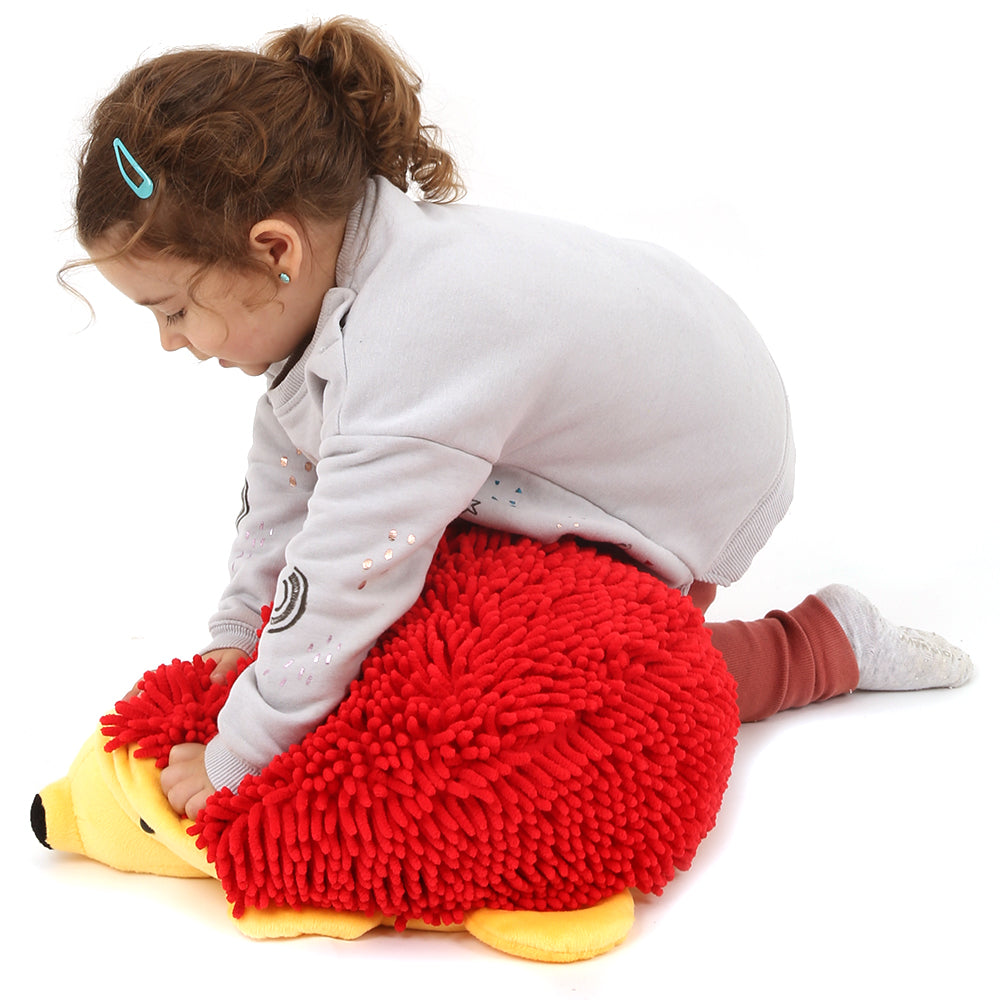 Girl playing with Harry the Sensory Hedgehog