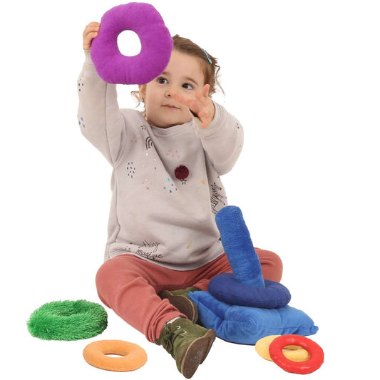Kid playing with the Weighted Sensory Stacking Toy