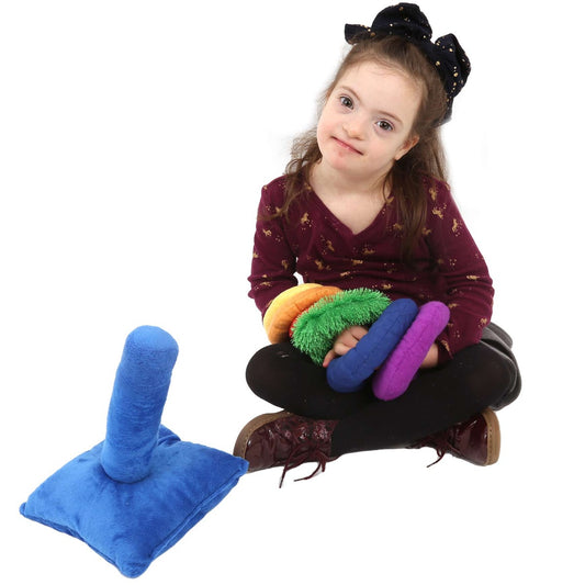 Girl playing with the Weighted Sensory Stacking Toy