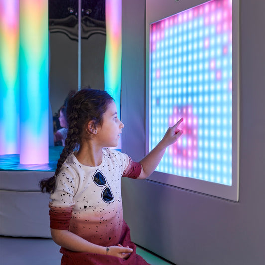 Girl using the Music Touch Wall