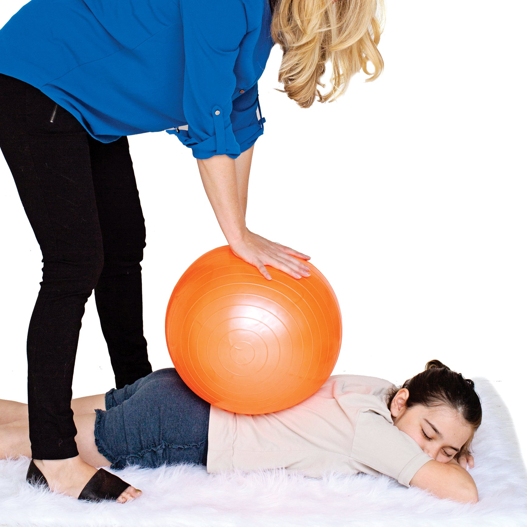 Woman using the orange therapy ball on someone's back