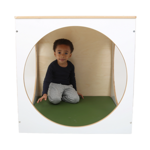 Child sitting inside the ElevatED™ Play House Cube
