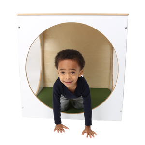Child playing inside the ElevatED™ Play House Cube
