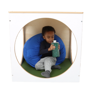 Child playing inside the ElevatED™ Play House Cube 