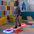 Child stepping on the Gel Step 'N Glow - Set of 4