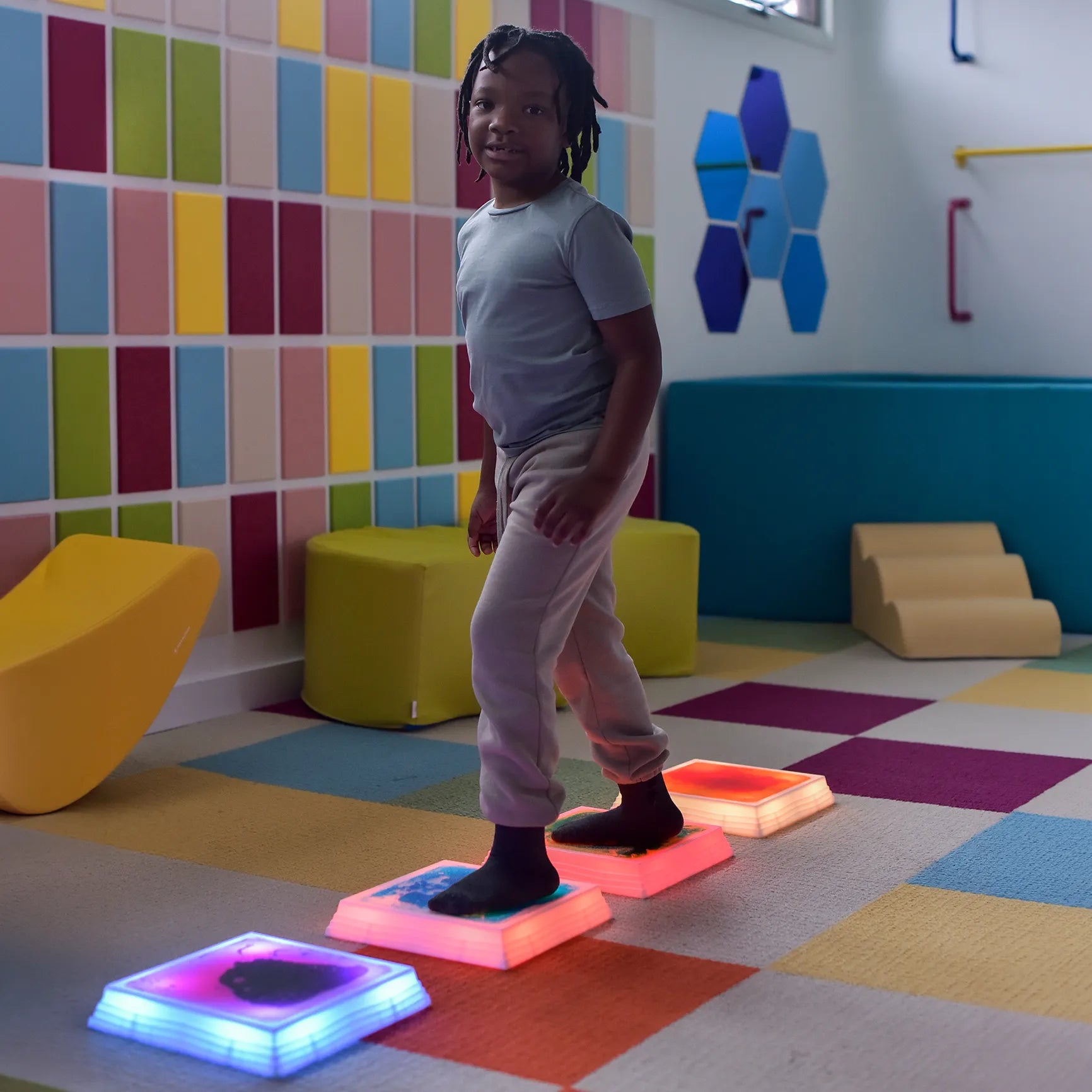 Child stepping on the Gel Step 'N Glow - Set of 4