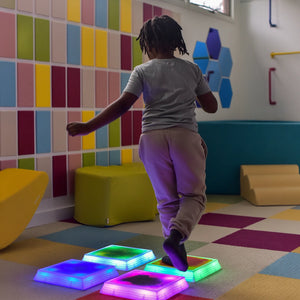 Child stepping on the Gel Step 'N Glow - Set of 4