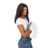 Girl holding the Hand-Hugger Weighted Pillow
 
