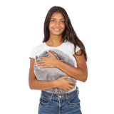 Girl smiling while holding the Hand-Hugger Weighted Pillow
 