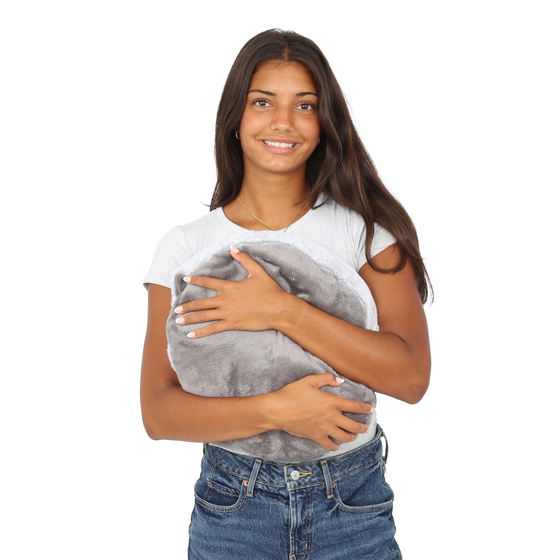 Girl smiling while holding the Hand-Hugger Weighted Pillow
 