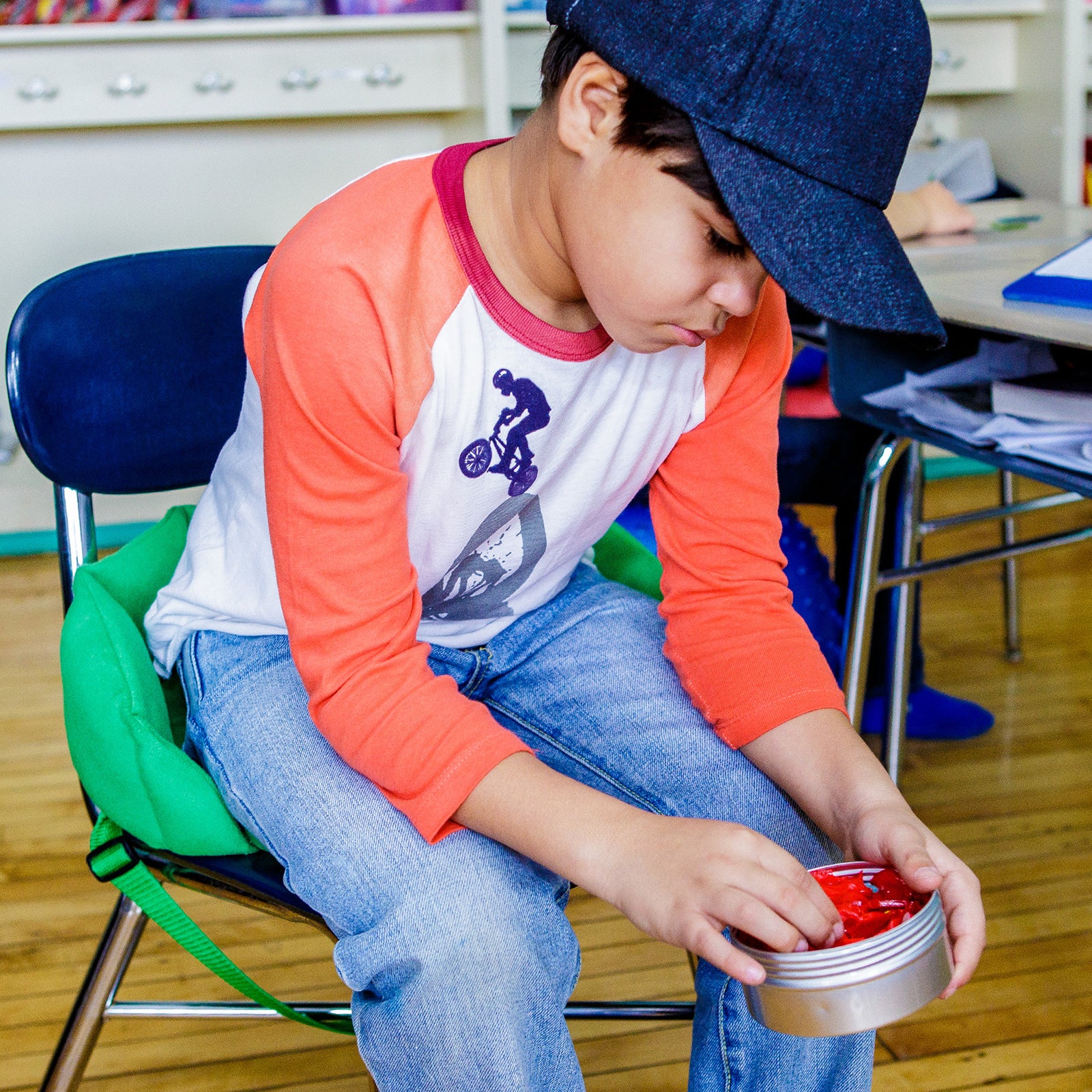 Boy using the green Boundary Chair