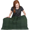Girl holding the green Jumbo Weighted Lap Pad