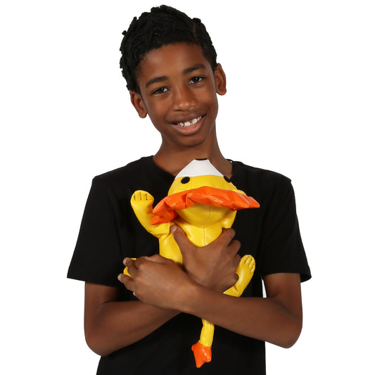 Boy smiling while holding Leo the Weighted Lion