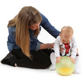 Mother holding onto a Baby playing with the sensory Rumble Roller