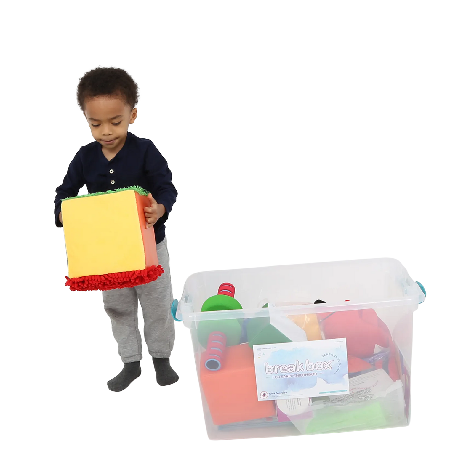 Child holding the Tactile sensory cube from the Early Childhood Sensory Toolkit™