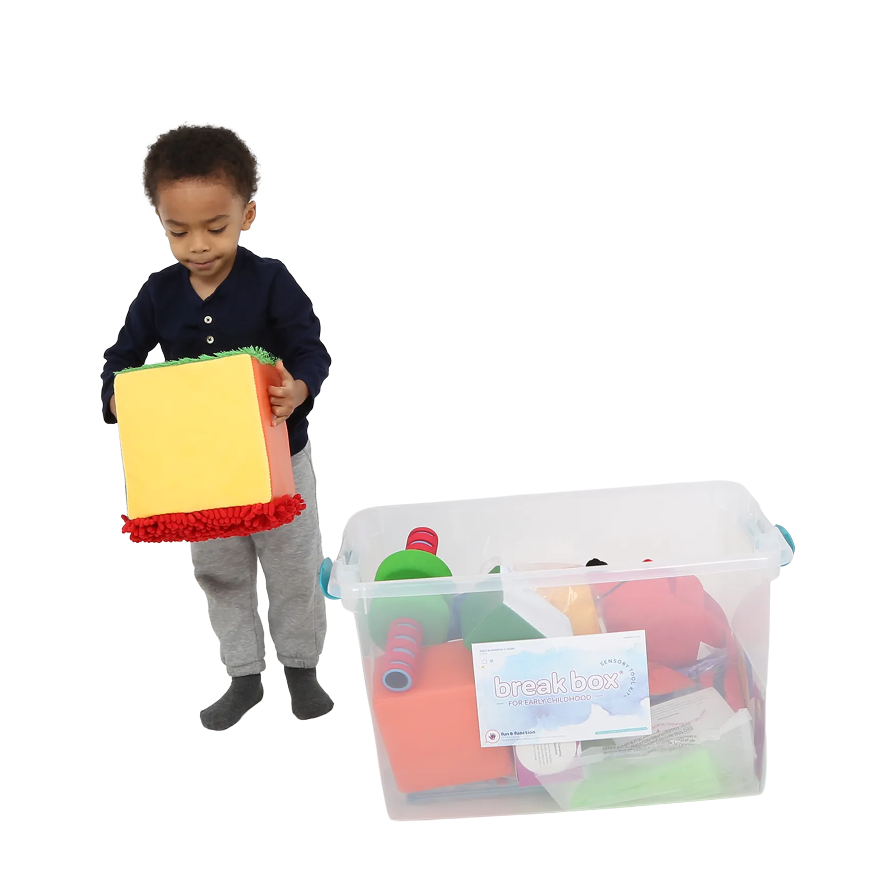 Child holding the Tactile sensory cube from the Early Childhood Sensory Toolkit™