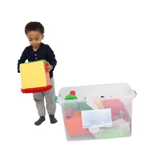 Child holding the Tactile sensory cube from the Early Childhood Sensory Toolkit™