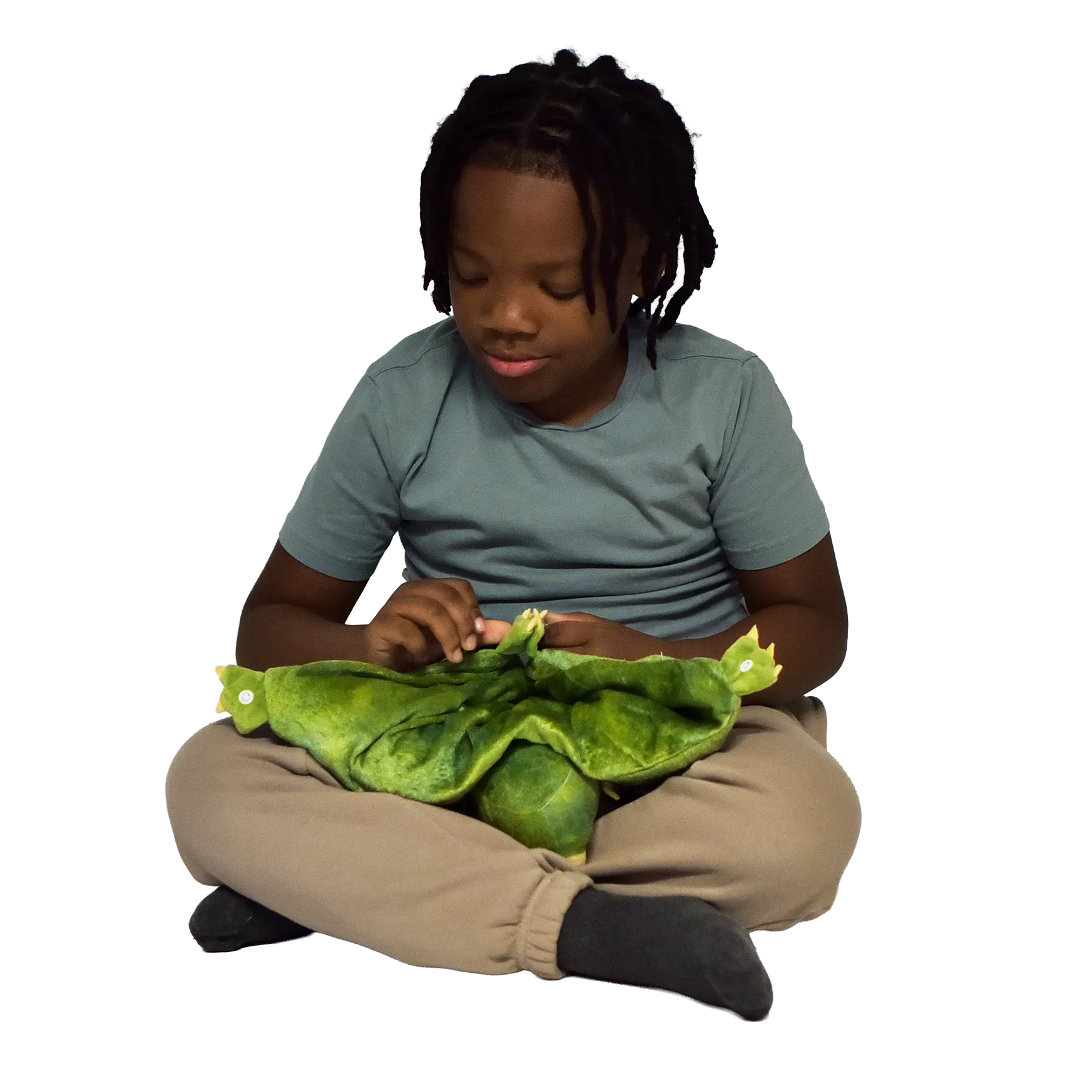 Boy sitting and holding the Weighted Animal Lap Pad