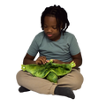 Boy sitting and holding the Weighted Animal Lap Pad