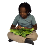 Boy sitting and holding the Weighted Animal Lap Pad