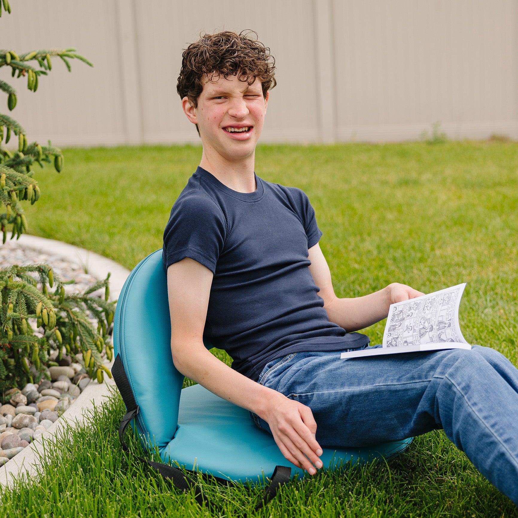 Person sitting outside while wearing the Ribbed Hug Tee, short sleeves