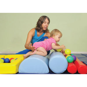 Mother helping baby play on The GYMBOX