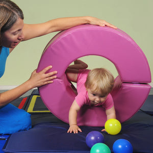 Mother helping baby play on The GYMBOX