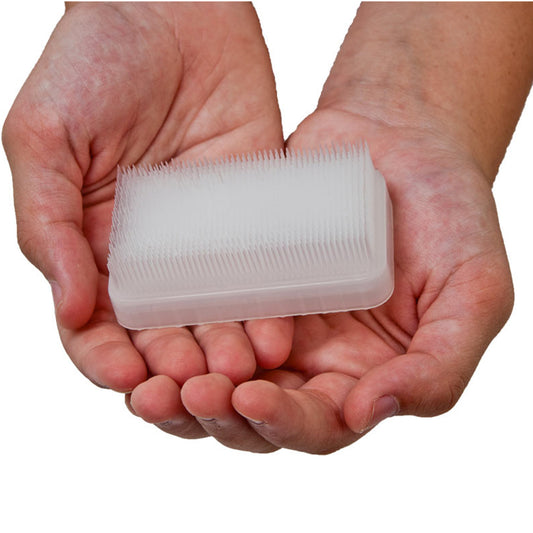 Hands holding the Sensory Brush