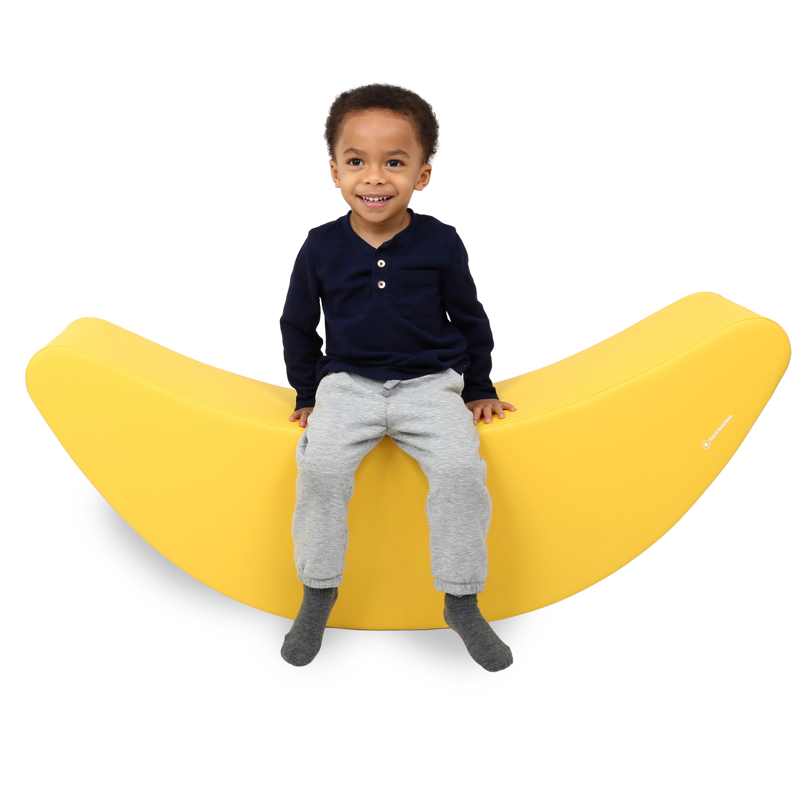Child sitting on the SensaSoft™ Banana Rocker