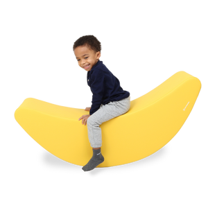 Child using the SensaSoft™ Banana Rocker