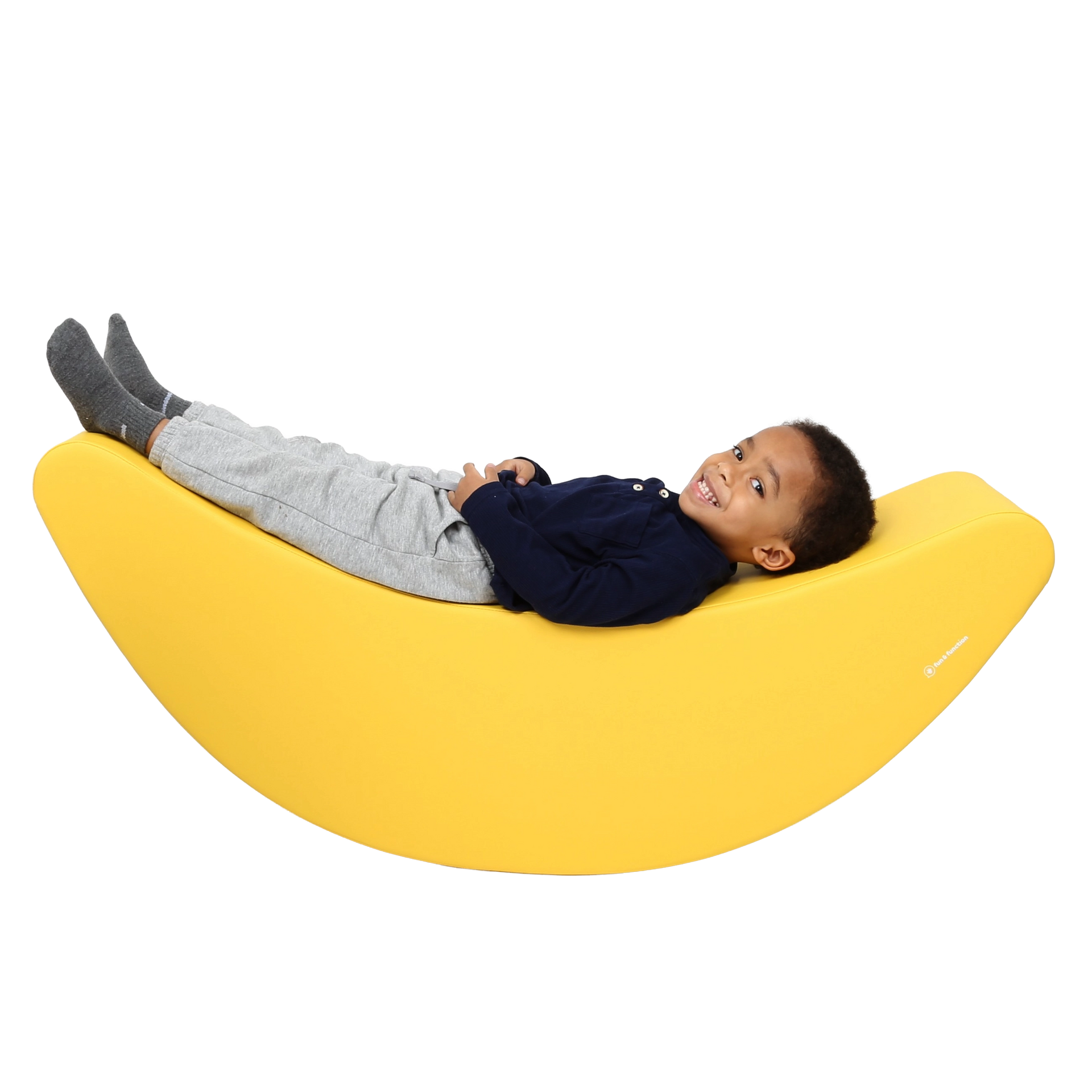 Child laying back on the SensaSoft™ Banana Rocker