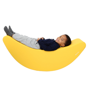 Child laying back on the SensaSoft™ Banana Rocker