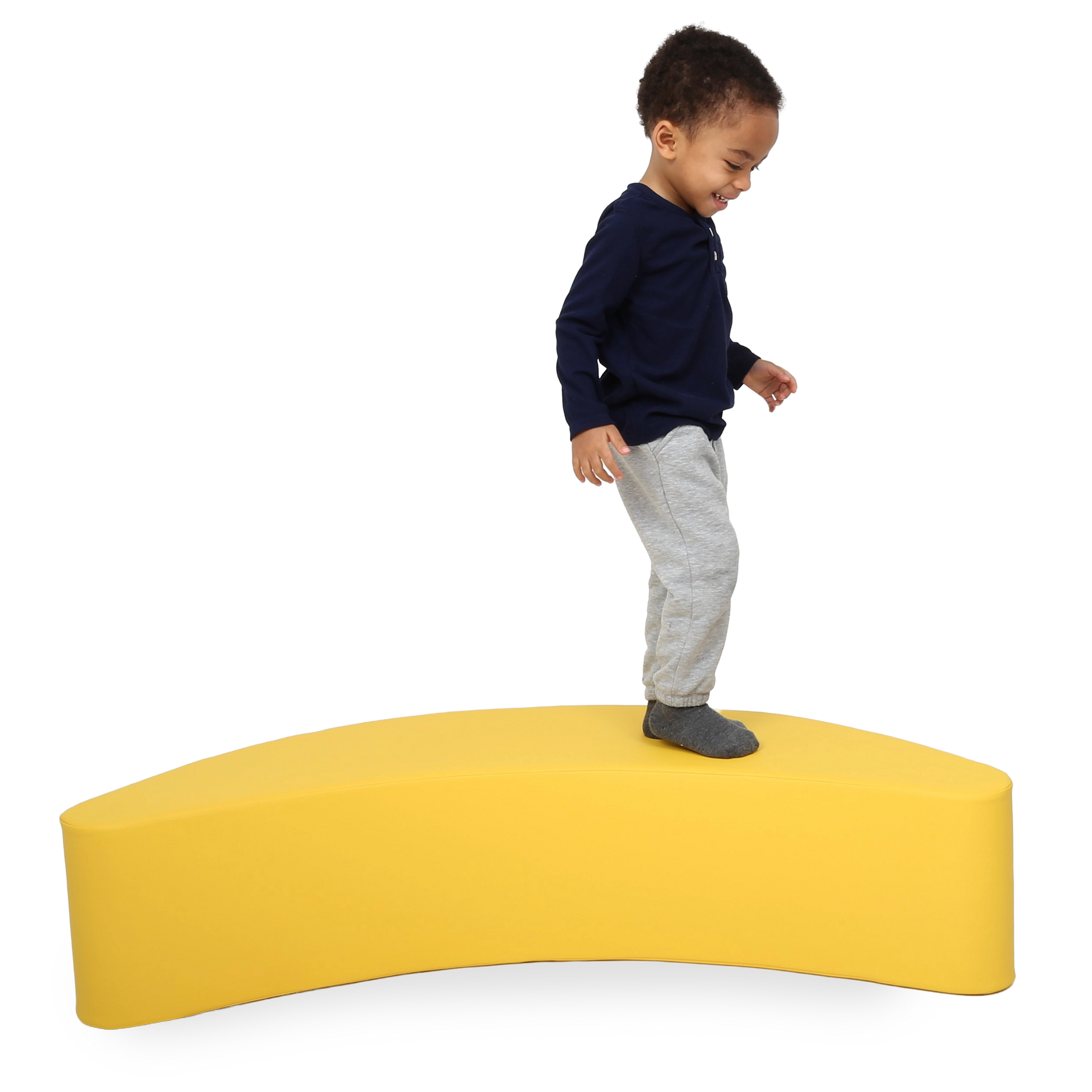 Child standing on the SensaSoft™ Banana Rocker