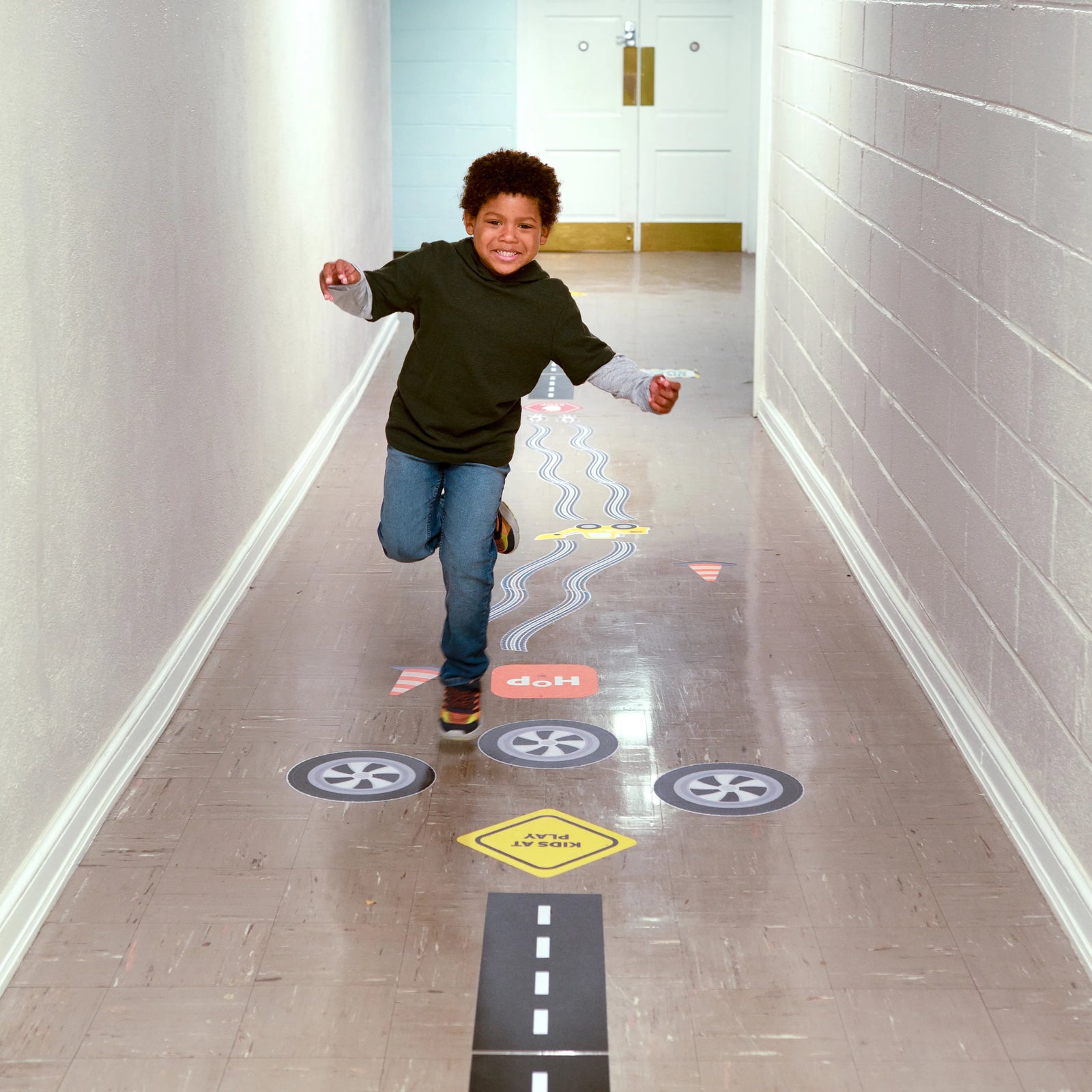 Child running on Sensory Pathway Decals 