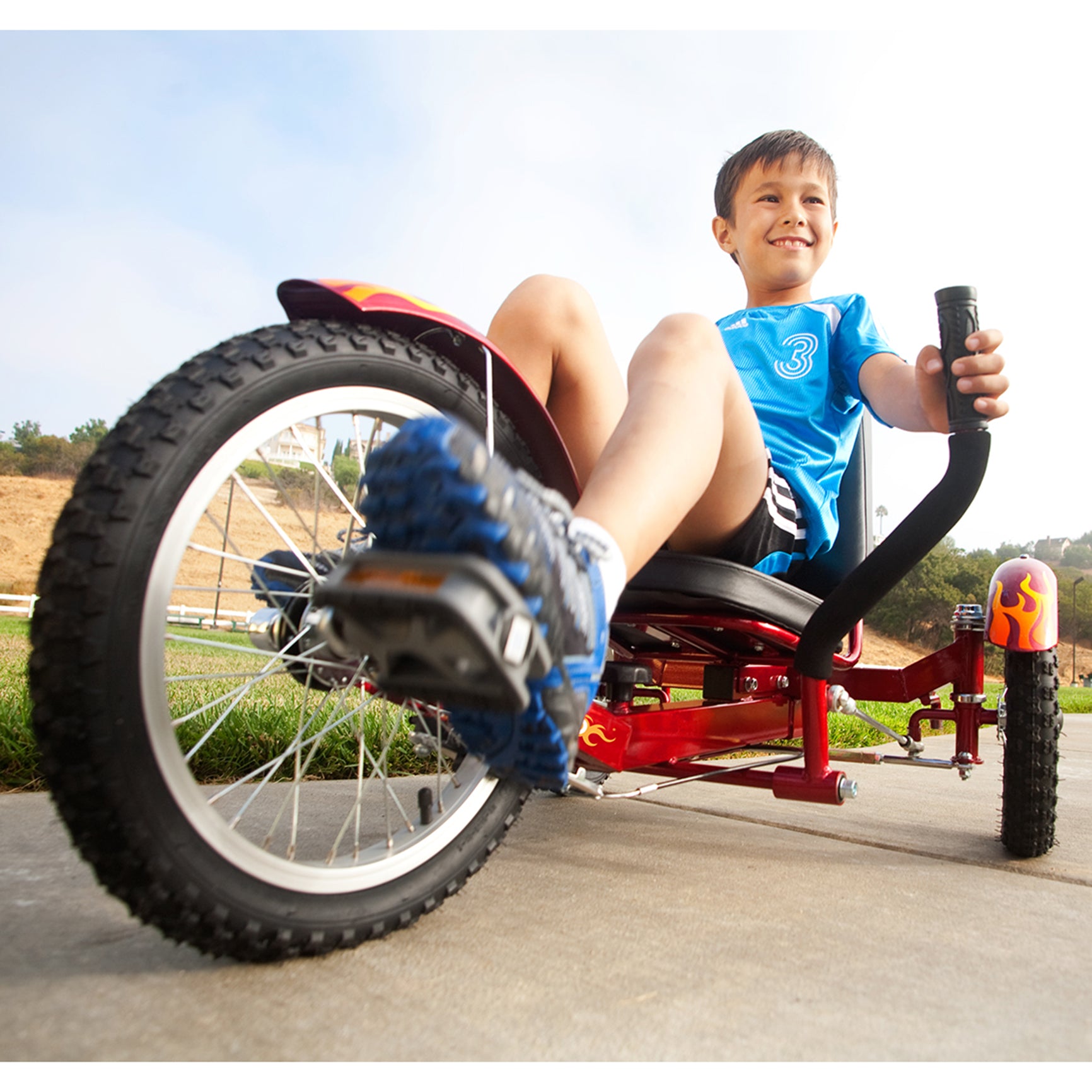 boy smiling while using the red Mobo Triton